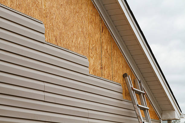 Professional Siding Replacement technician working in Luxor, PA
